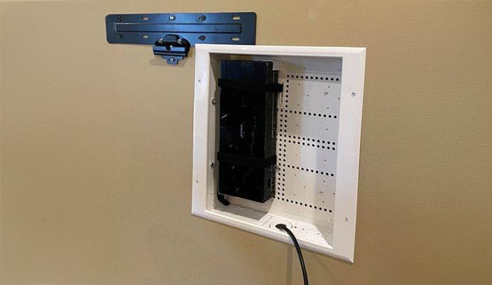Behind TV media enclosure mounting