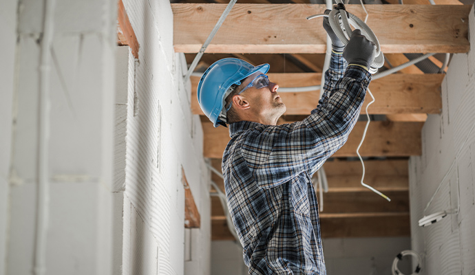 Electrical technician installing wires