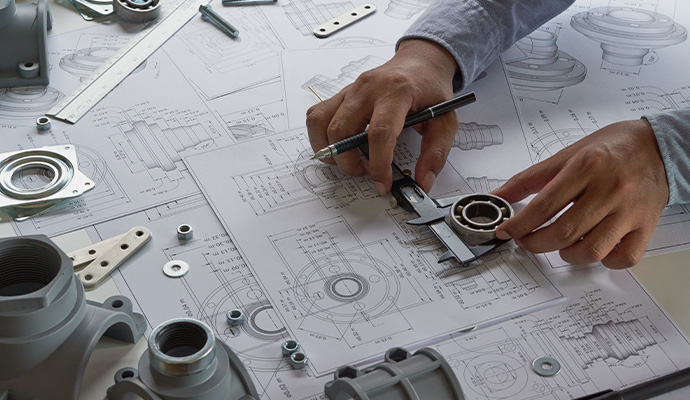 Engineer drawing mechanical design blueprints